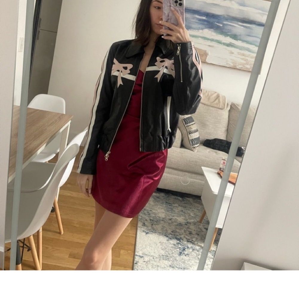 Black leather jacket with bows